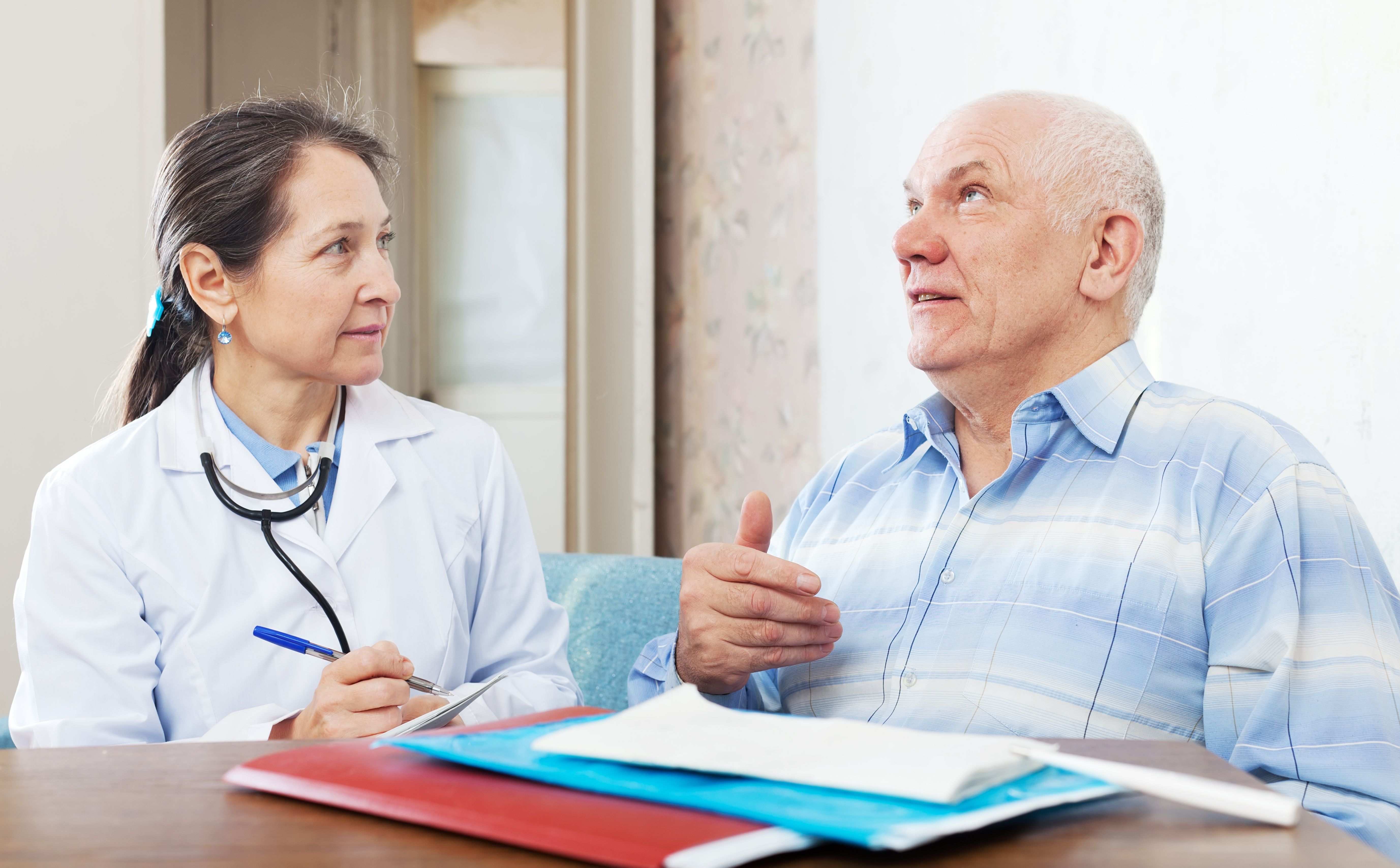 Doctor examining senior patient