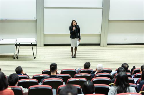 Female teacher stands in front of large class of students Female teacher is uncivil standing in front of class of nursing students