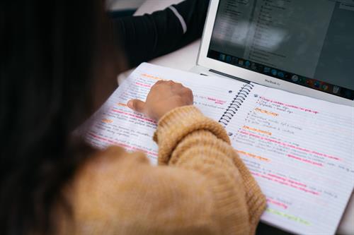 Student taking notes from lecture is less effective than interactive learning.