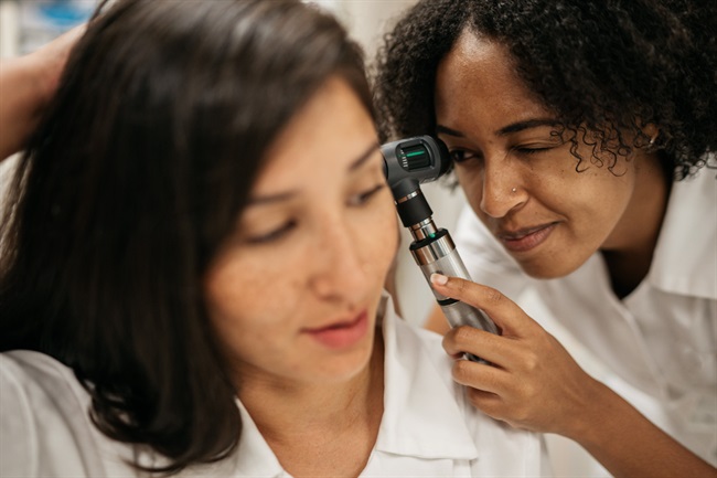 Student nurse examining client