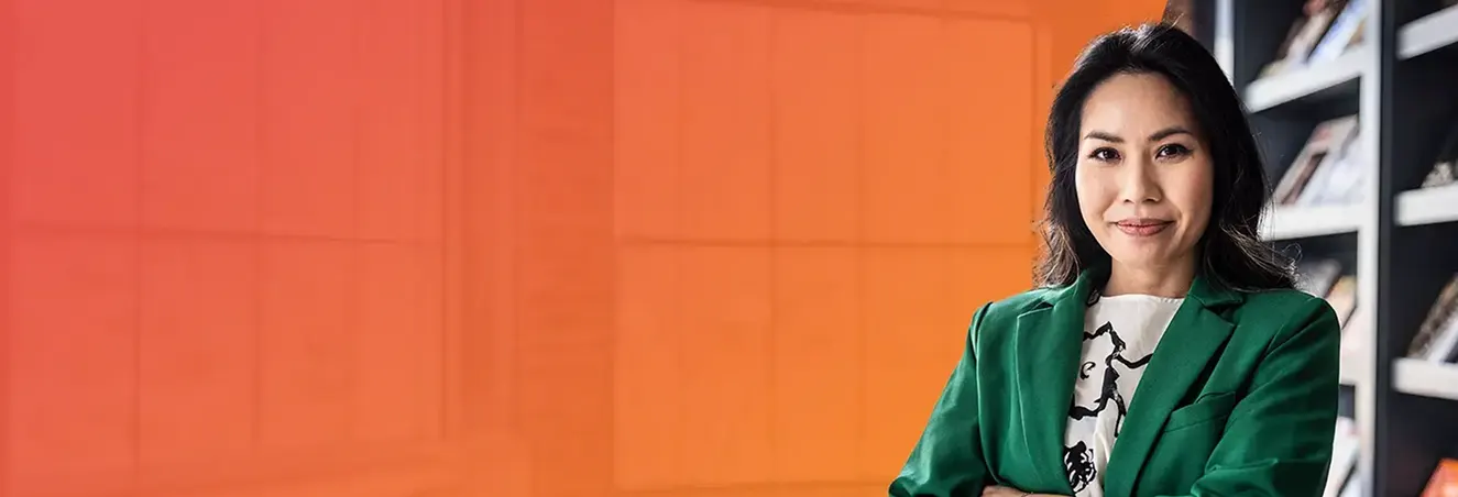 Smiling nurse educator in a green blazer